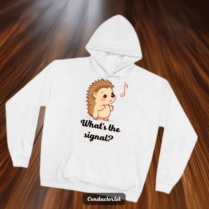Funny Hoodie: A curious cartoon hedgehog intently listening to a prominent musical cue, offering cozy comfort and a humorous, heartwarming theme.